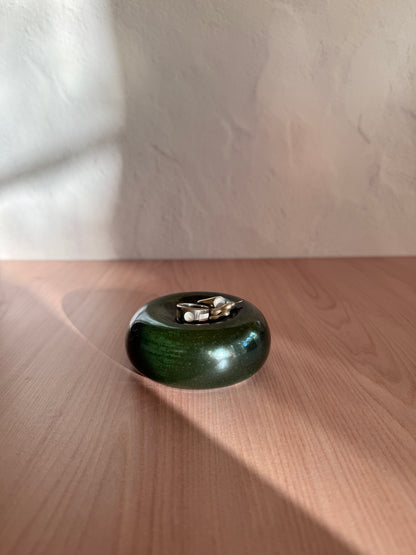 Round handmade ceramic catch-all dish with glossy forest green glaze