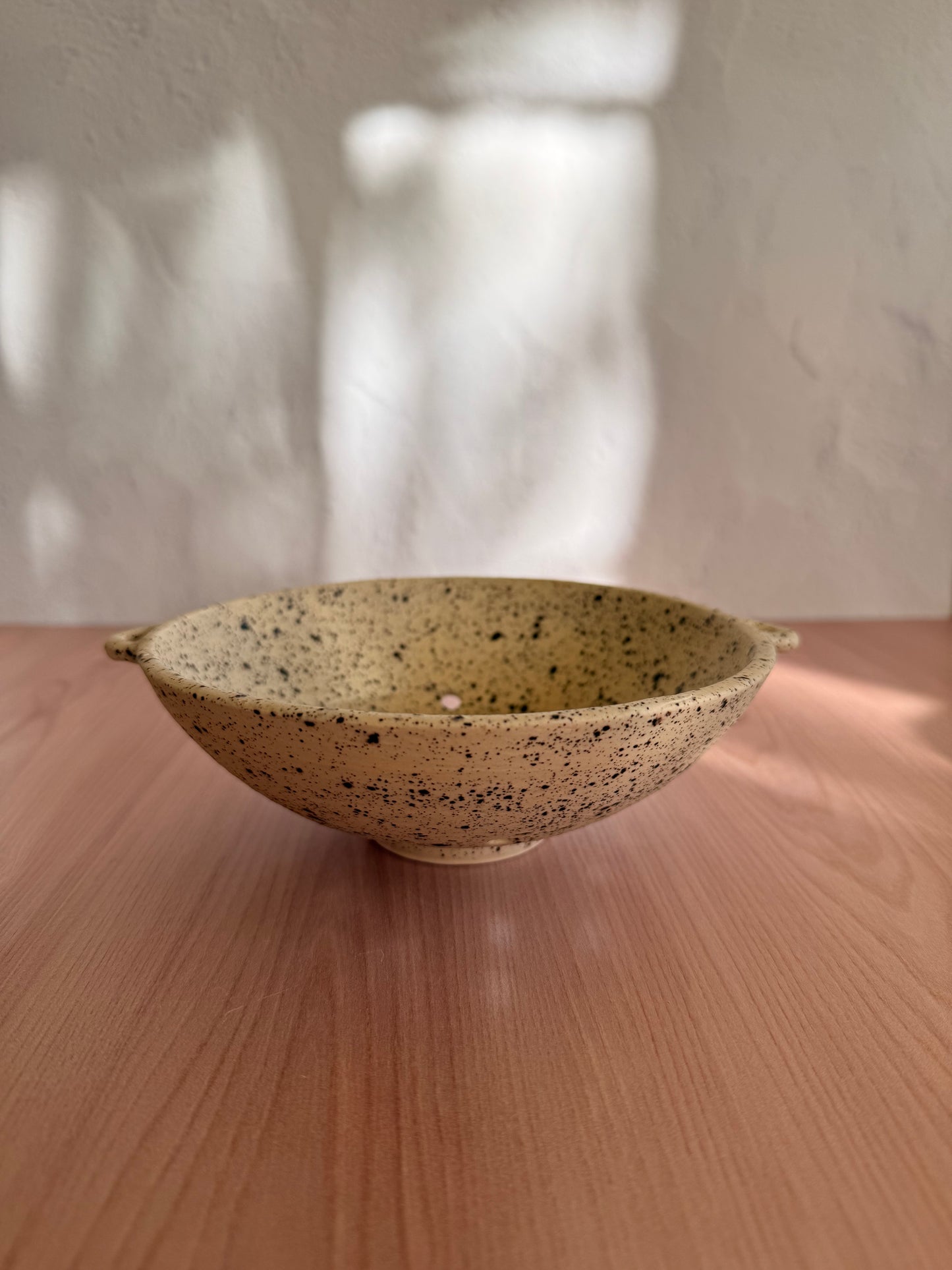 Handmade ceramic berry colander with speckled oatmeal glaze