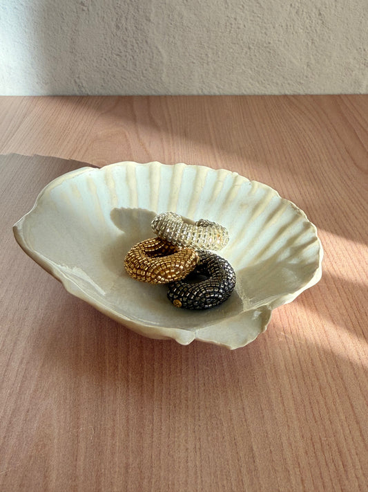 Handmade ceramic scallop shell dish in a cream glaze