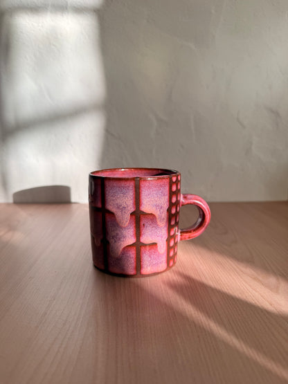 Handmade ceramic mug with dusty mauve crackle glaze and grid texture