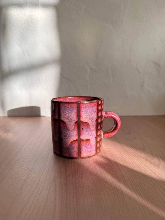 Handmade ceramic mug with dusty mauve crackle glaze and grid texture