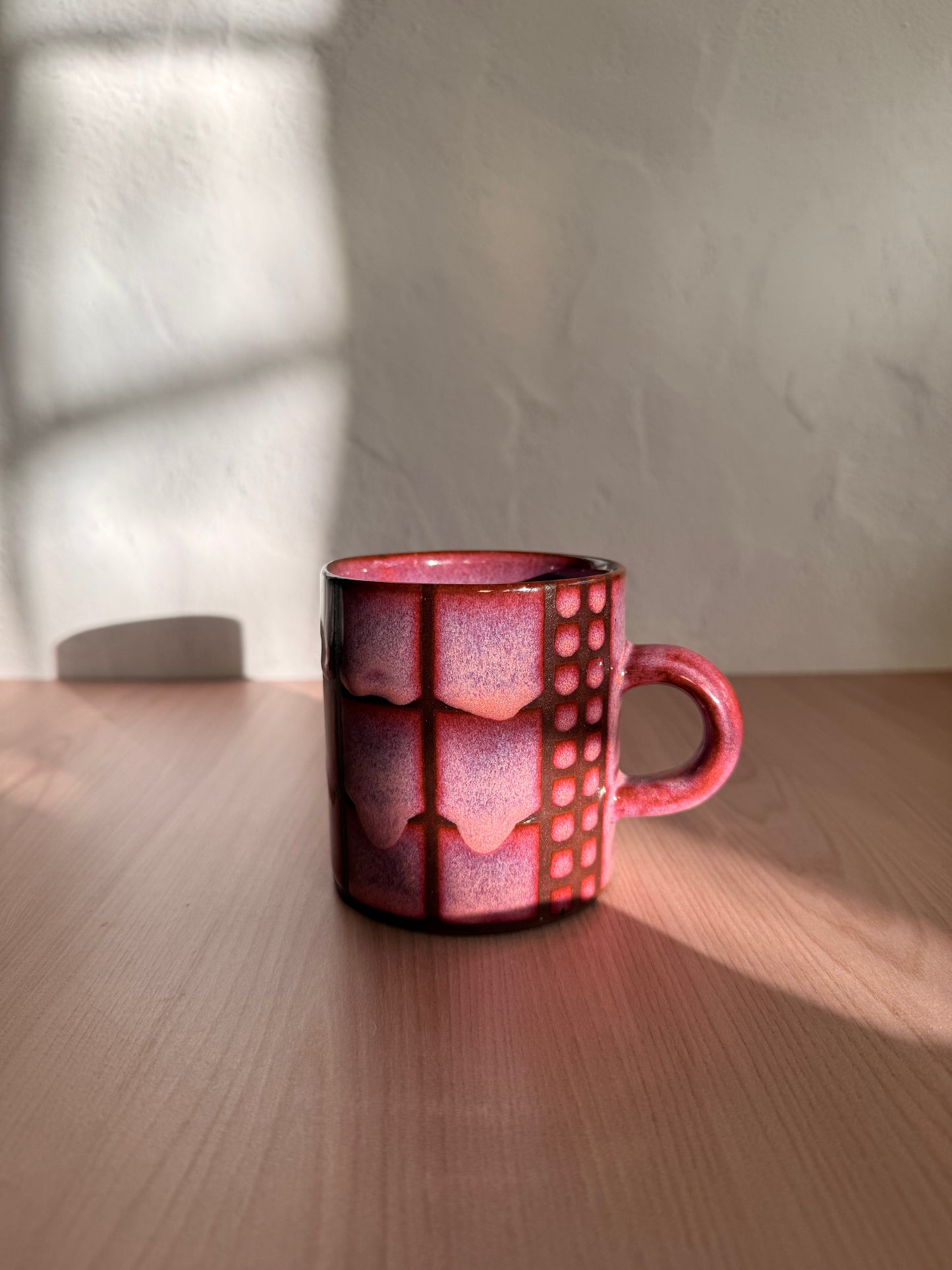 Handmade ceramic mug with coral crackle glaze and grid texture