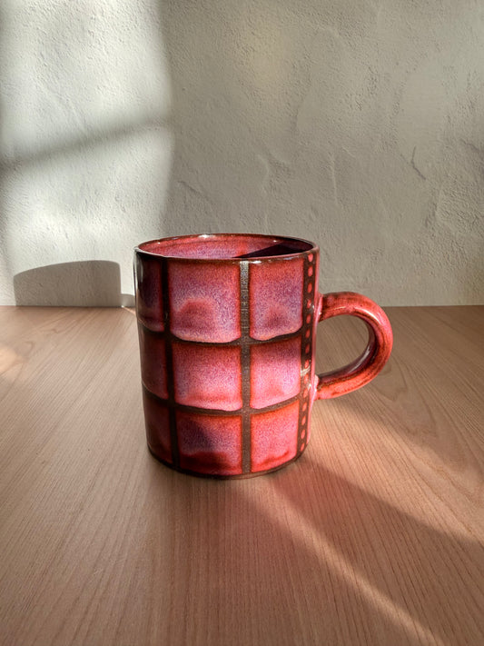 Handmade ceramic mug with blush pink crackle glaze and grid texture