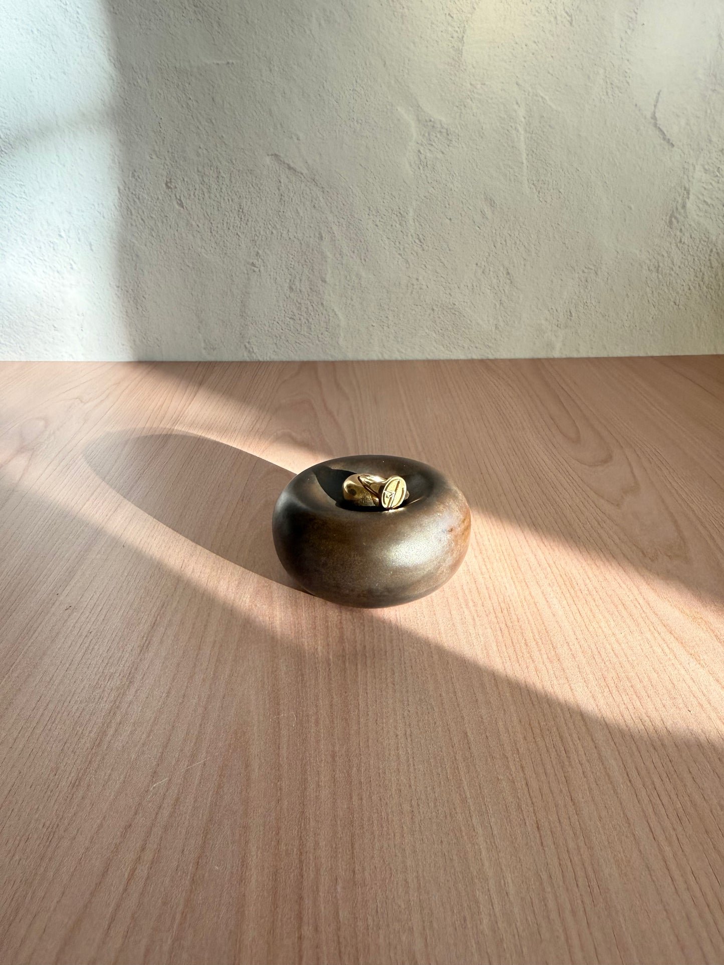 Small handmade ceramic catch-all dish with metallic bronze glaze