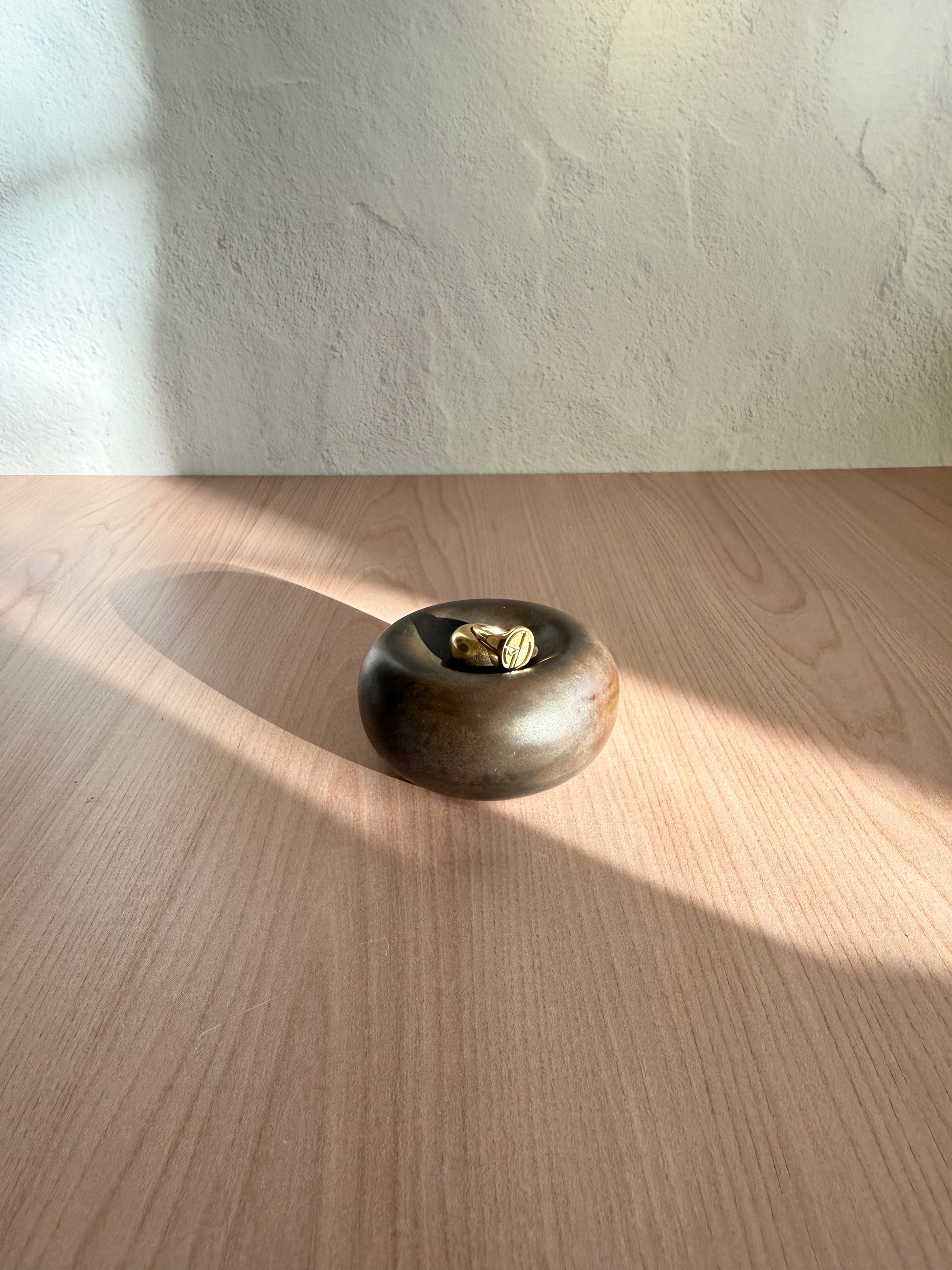 Small handmade ceramic catch-all dish with metallic bronze glaze