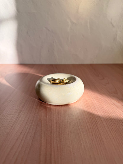 Round handmade ceramic catch-all dish with matte cream glaze