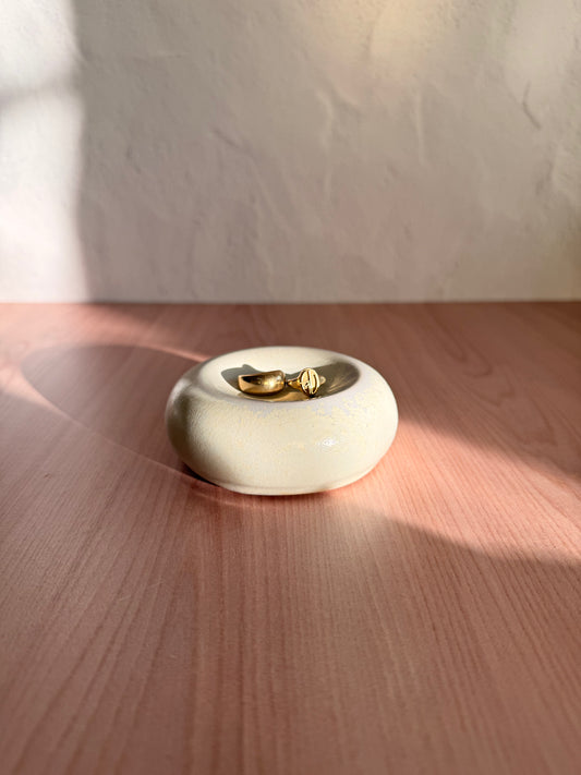 Round handmade ceramic catch-all dish with matte cream glaze