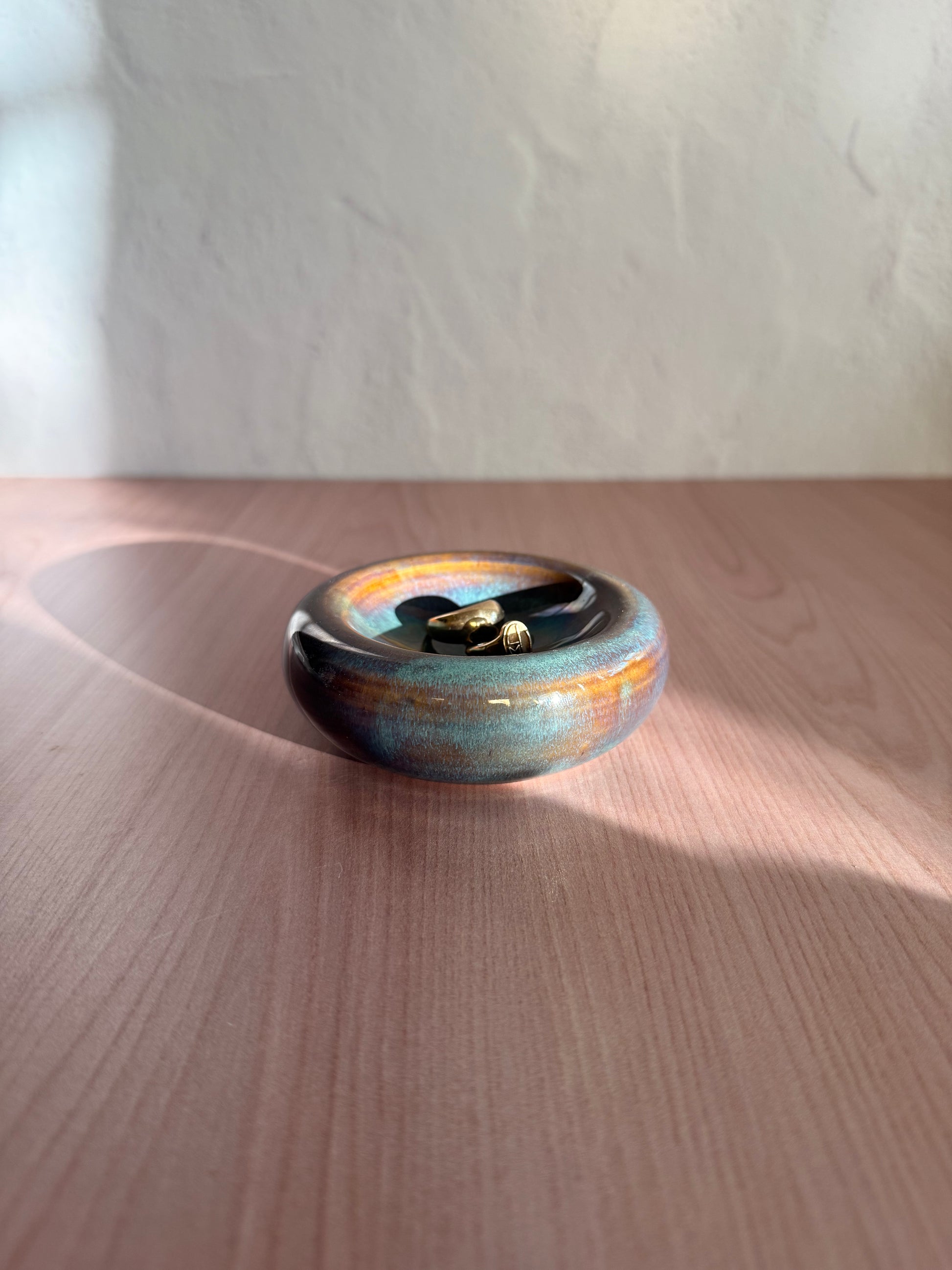 Round handmade ceramic catch-all dish with multi-tone drip glaze