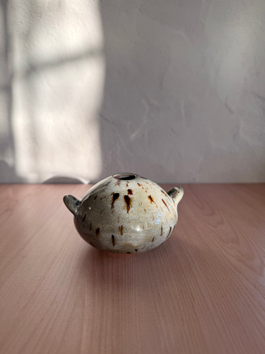 Small handmade ceramic bud vase with handles and speckled cream glaze