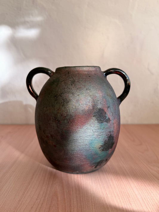 Handmade raku-fired ceramic vase with mottled copper and blue finish